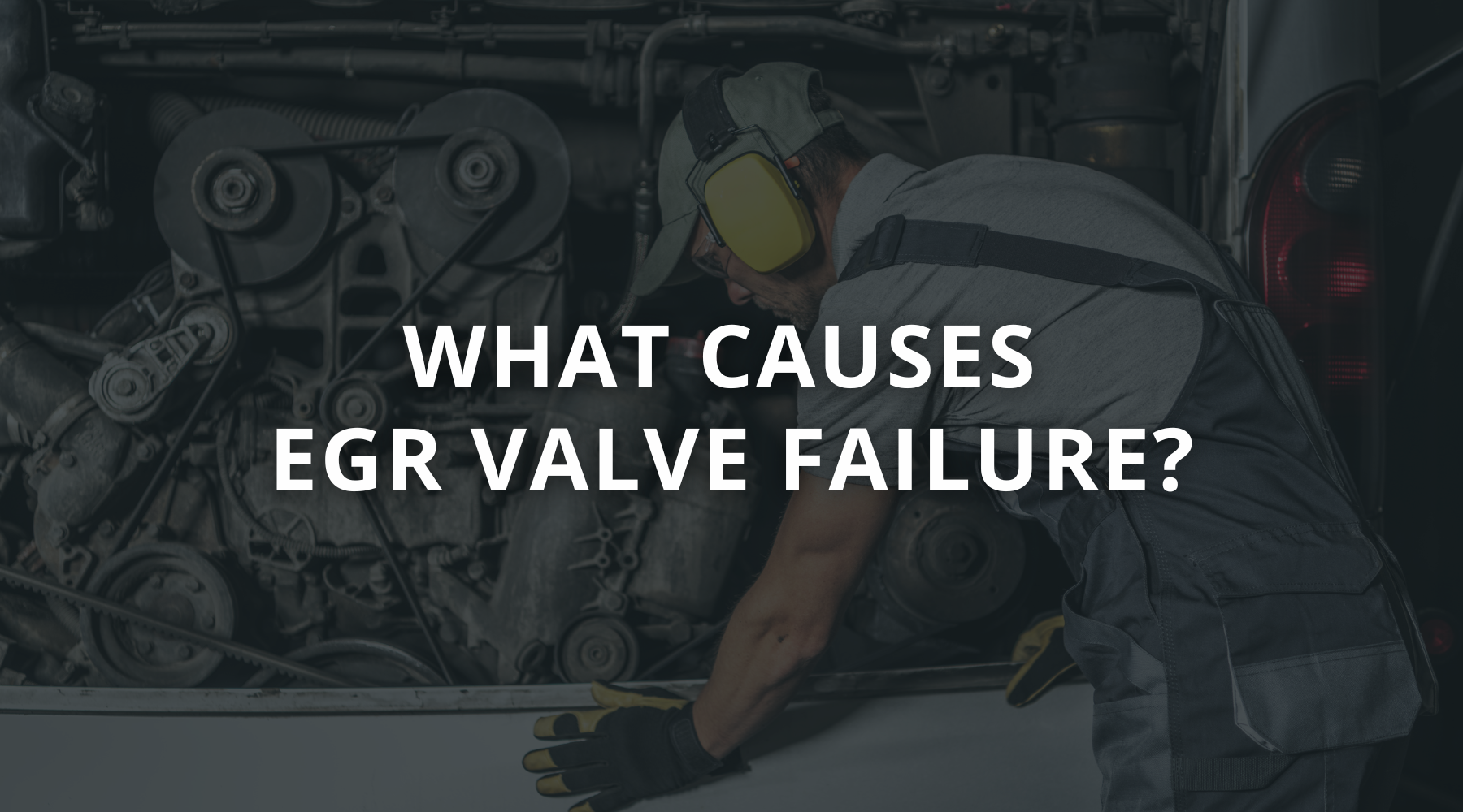 Heavy equipment diesel mechanic working on EGR valve removed from excavator engine